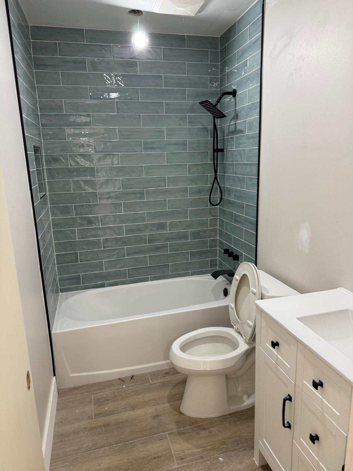 Full bathroom remodel with subway tile