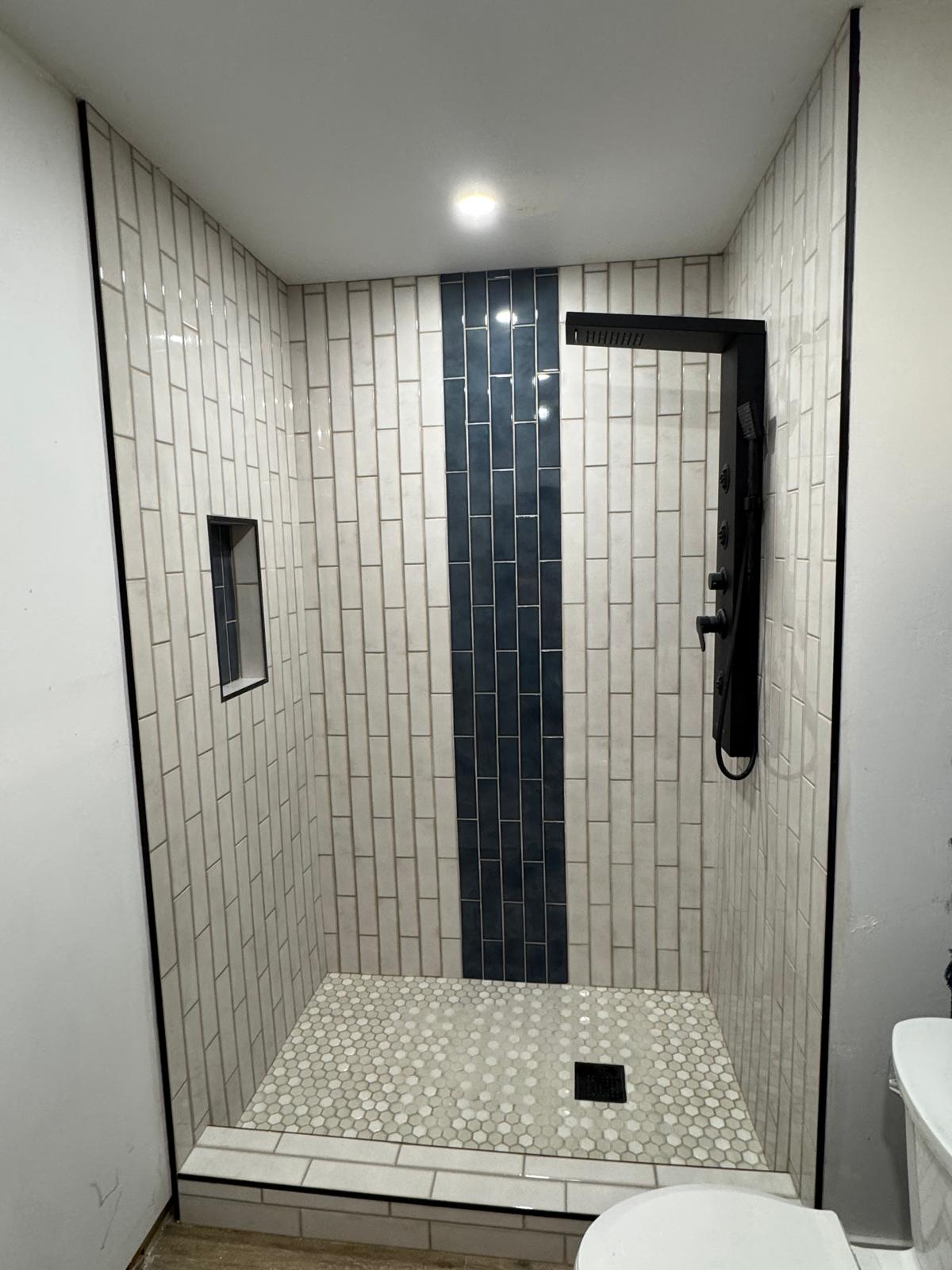 Modern walk-in shower with accent tile