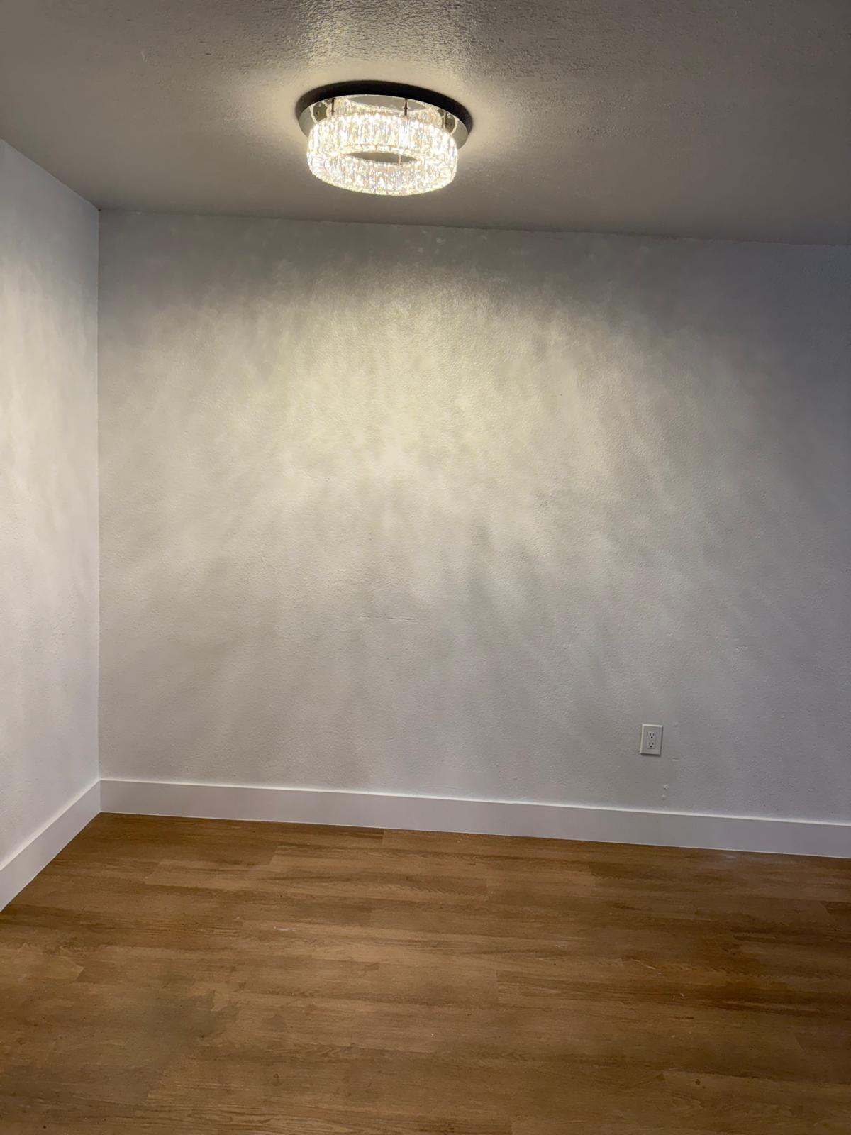 Finished room with chandelier